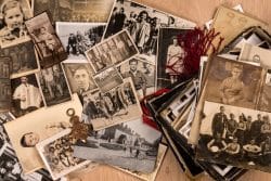 Black and white photos and other memorabilia on a table.